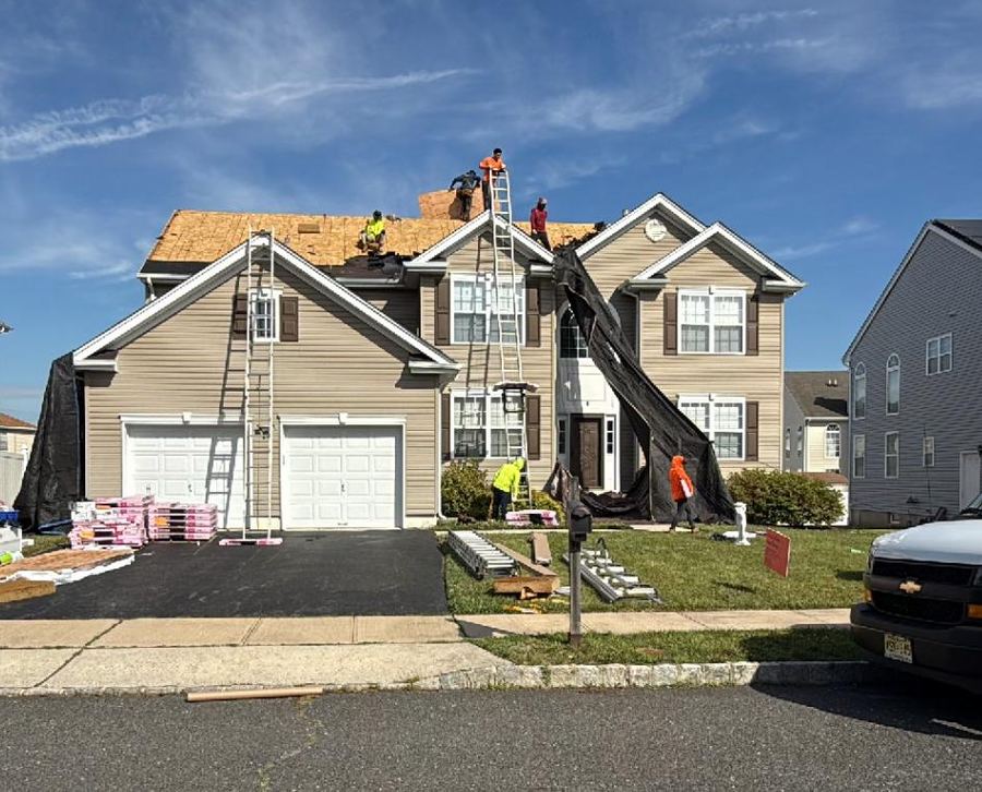 Roof mid-installation with crew working